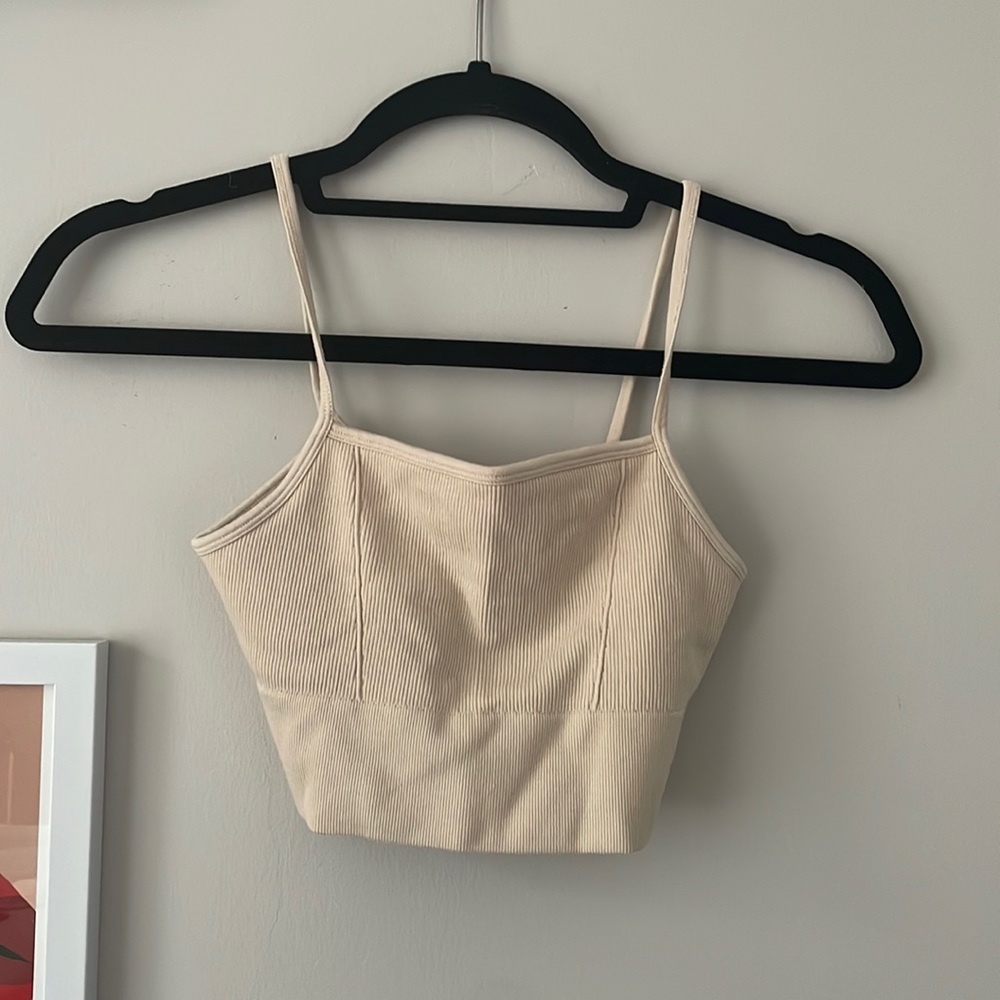 Fabletics cream sports bra. Size SM. Like new. No stains or rips.